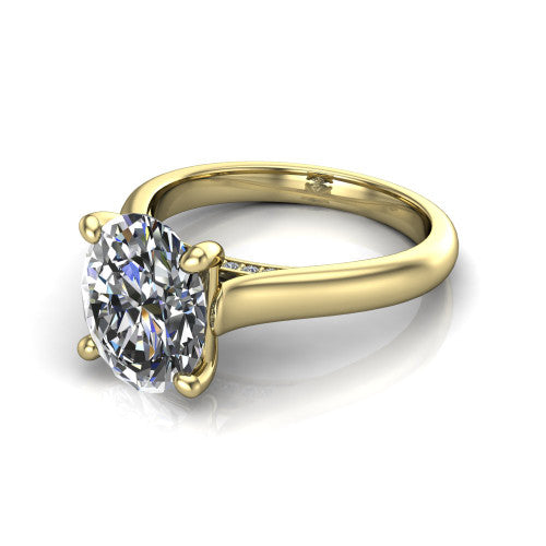 Madilyn oval solitaire engagement ring in 14K Yellow Gold, three-quarter perspective showing the brilliant oval center diamond on a slim polished plain band