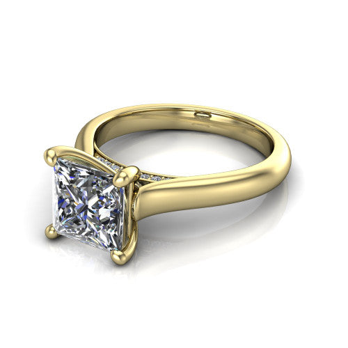 Madilyn princess solitaire engagement ring in 14K Yellow Gold, three-quarter perspective showing the brilliant princess-cut center diamond on a slim polished plain band