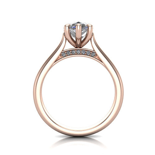 Madilyn pear solitaire engagement ring in 18K Rose Gold, through-finger front profile showing the hidden pave accent row beneath the basket and open under-gallery