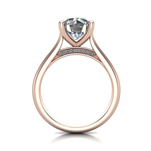 Madilyn round solitaire engagement ring in 14K Rose Gold, through-finger front profile showing the hidden pave accent row beneath the basket and open under-gallery
