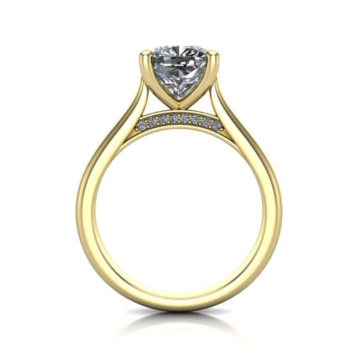 Madilyn cushion solitaire engagement ring in 18K Yellow Gold, through-finger front profile showing the hidden pave accent row beneath the basket and open under-gallery