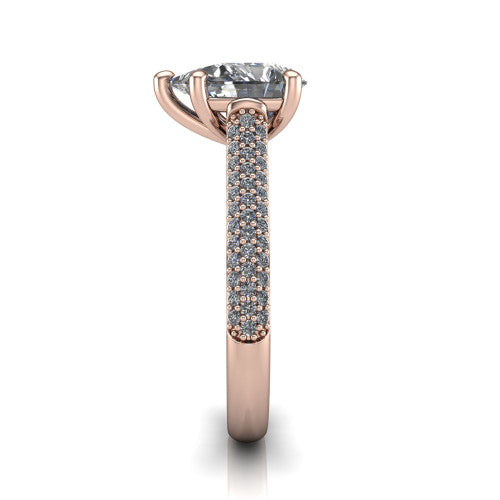 Izabella pear solitaire engagement ring in 18K Rose Gold, side profile showing the 3-sided micropave diamonds wrapping the top and outer sides of the shank