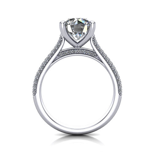 Izabella round solitaire engagement ring in Platinum, through-finger front profile showing the tall basket, cathedral lift, and micropave shank
