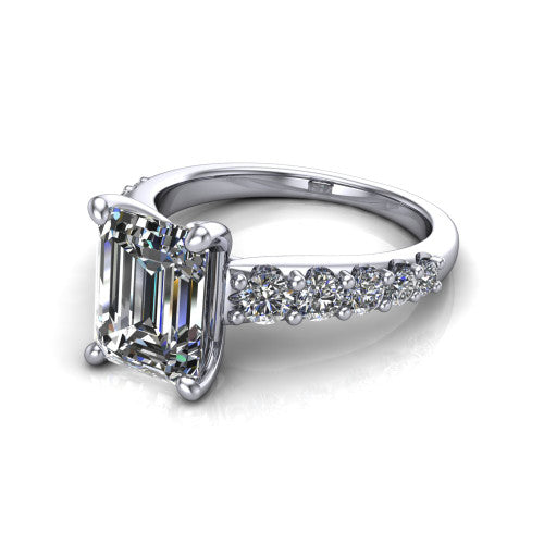 Nina emerald solitaire engagement ring in 14K White Gold, three-quarter perspective showing the step-cut emerald center diamond on a pave-accent shank with a hidden under-halo beneath the center stone