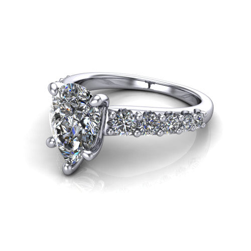 Nina pear solitaire engagement ring in Platinum, three-quarter perspective showing the brilliant pear-cut center diamond on a pave-accent shank with a hidden under-halo beneath the center stone