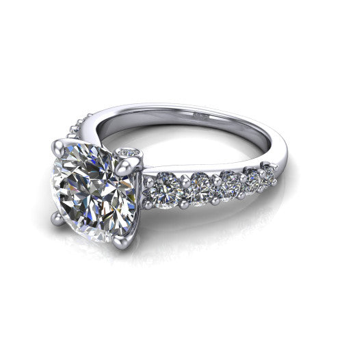 Nina round solitaire engagement ring in 14K White Gold, three-quarter perspective showing the brilliant round center diamond on a pave-accent shank with a hidden under-halo beneath the center stone