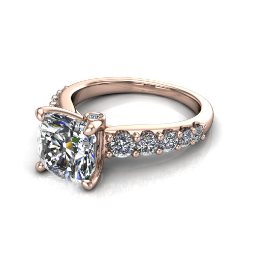Nina cushion solitaire engagement ring in 18K Rose Gold, three-quarter perspective showing the brilliant cushion-cut center diamond on a pave-accent shank with a hidden under-halo beneath the center stone