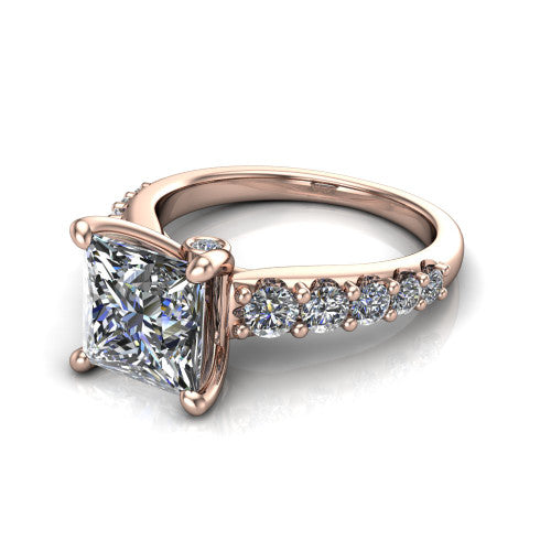 Nina princess solitaire engagement ring in 14K Rose Gold, three-quarter perspective showing the brilliant princess-cut center diamond on a pave-accent shank with a hidden under-halo beneath the center stone