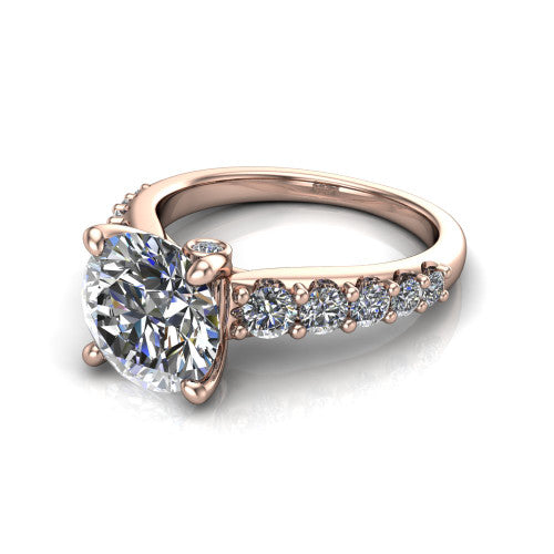 Nina round solitaire engagement ring in 18K Rose Gold, three-quarter perspective showing the brilliant round center diamond on a pave-accent shank with a hidden under-halo beneath the center stone
