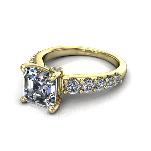 Nina square emerald solitaire engagement ring in 14K Yellow Gold, three-quarter perspective showing the step-cut square emerald center diamond on a pave-accent shank with a hidden under-halo beneath the center stone