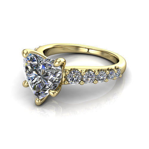 Nina heart solitaire engagement ring in 14K Yellow Gold, three-quarter perspective showing the brilliant heart-shaped center diamond on a pave-accent shank with a hidden under-halo beneath the center stone