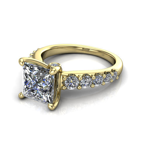 Nina princess solitaire engagement ring in 14K Yellow Gold, three-quarter perspective showing the brilliant princess-cut center diamond on a pave-accent shank with a hidden under-halo beneath the center stone