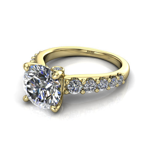 Nina round solitaire engagement ring in 14K Yellow Gold, three-quarter perspective showing the brilliant round center diamond on a pave-accent shank with a hidden under-halo beneath the center stone
