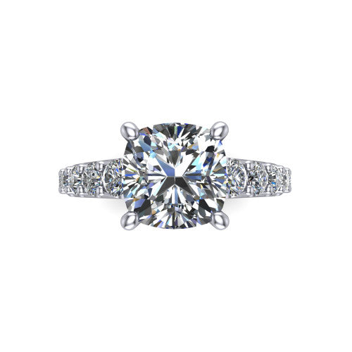 Nina cushion solitaire engagement ring in 18K White Gold, top-down view showing the brilliant cushion-cut center diamond held by four prongs above the pave shoulder accents