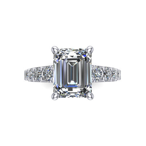 Nina emerald solitaire engagement ring in 14K White Gold, top-down view showing the step-cut emerald center diamond held by four prongs above the pave shoulder accents