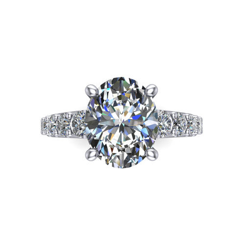 Nina oval solitaire engagement ring in 18K White Gold, top-down view showing the brilliant oval center diamond held by four prongs above the pave shoulder accents