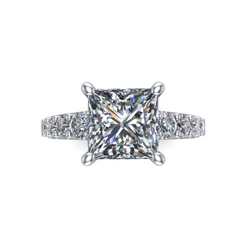 Nina princess solitaire engagement ring in Platinum, top-down view showing the brilliant princess-cut center diamond held by four prongs above the pave shoulder accents