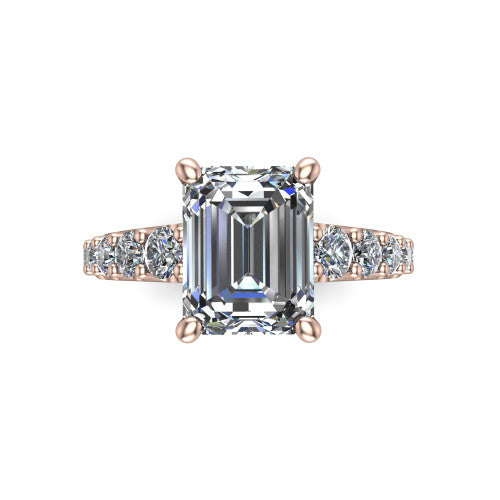 Nina emerald solitaire engagement ring in 18K Rose Gold, top-down view showing the step-cut emerald center diamond held by four prongs above the pave shoulder accents