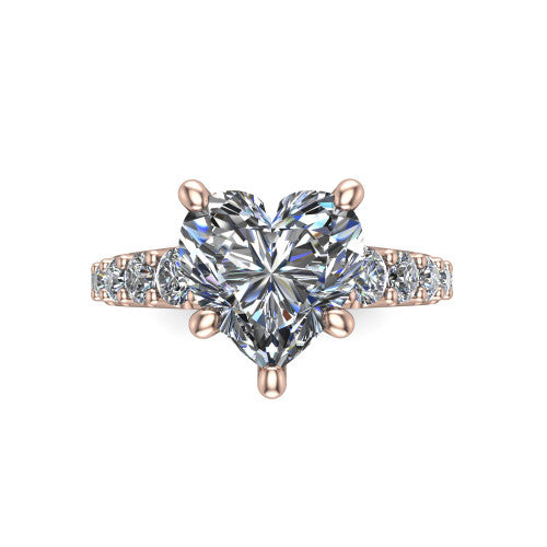 Nina heart solitaire engagement ring in 14K Rose Gold, top-down view showing the brilliant heart-shaped center diamond held by four prongs above the pave shoulder accents