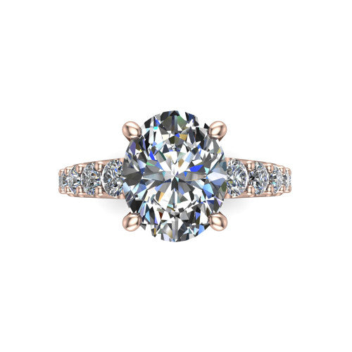 Nina oval solitaire engagement ring in 14K Rose Gold, top-down view showing the brilliant oval center diamond held by four prongs above the pave shoulder accents