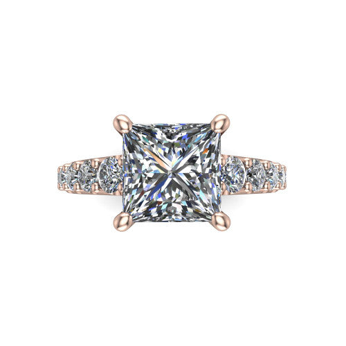Nina princess solitaire engagement ring in 18K Rose Gold, top-down view showing the brilliant princess-cut center diamond held by four prongs above the pave shoulder accents