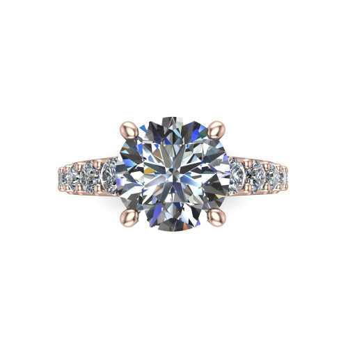 Nina round solitaire engagement ring in 18K Rose Gold, top-down view showing the brilliant round center diamond held by four prongs above the pave shoulder accents