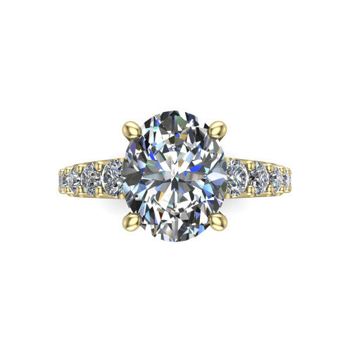 Nina oval solitaire engagement ring in 18K Yellow Gold, top-down view showing the brilliant oval center diamond held by four prongs above the pave shoulder accents