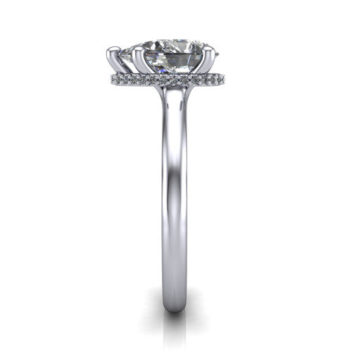 Jocelyn pear hidden halo engagement ring in Platinum, side profile showing the hidden halo beneath the basket