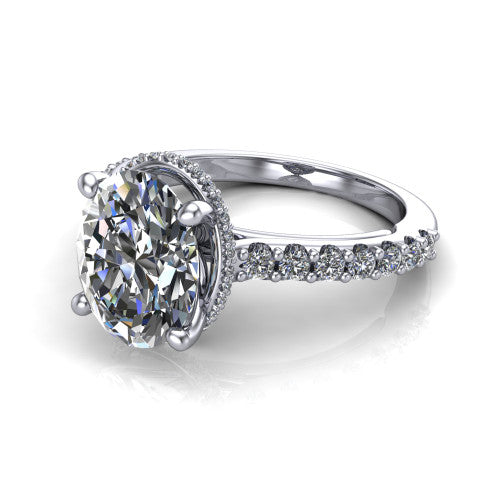 Nadia oval hidden halo engagement ring in Platinum, three-quarter perspective showing the brilliant oval center diamond with a hidden pave halo beneath the center stone on a pave eternity band