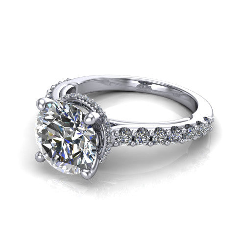 Nadia round hidden halo engagement ring in 18K White Gold, three-quarter perspective showing the brilliant round center diamond with a hidden pave halo beneath the center stone on a pave eternity band