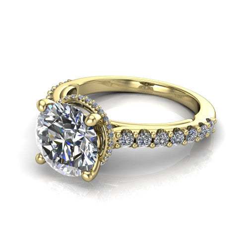 Nadia round hidden halo engagement ring in 18K Yellow Gold, three-quarter perspective showing the brilliant round center diamond with a hidden pave halo beneath the center stone on a pave eternity band