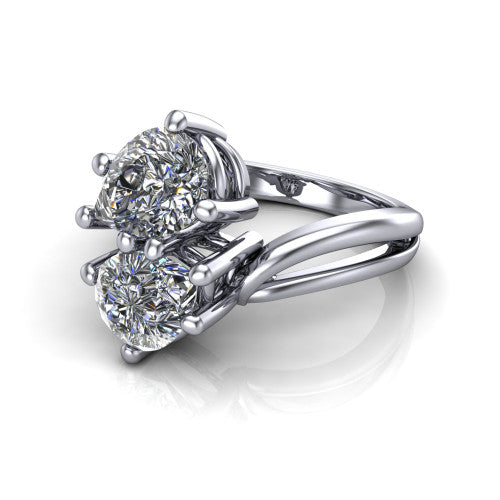 Lexi pear three stone engagement ring in Platinum, three-quarter perspective showing two brilliant pear-cut diamonds set diagonally on a bypass split shank with plain bands