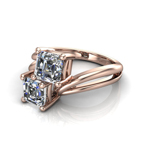 Lexi square emerald three stone engagement ring in 18K Rose Gold, three-quarter perspective showing two step-cut square emerald diamonds set diagonally on a bypass split shank with plain bands