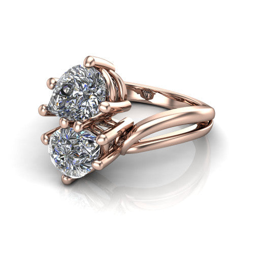 Lexi pear three stone engagement ring in 14K Rose Gold, three-quarter perspective showing two brilliant pear-cut diamonds set diagonally on a bypass split shank with plain bands