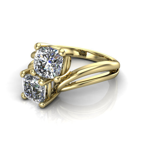 Lexi cushion three stone engagement ring in 14K Yellow Gold, three-quarter perspective showing two brilliant cushion-cut diamonds set diagonally on a bypass split shank with plain bands