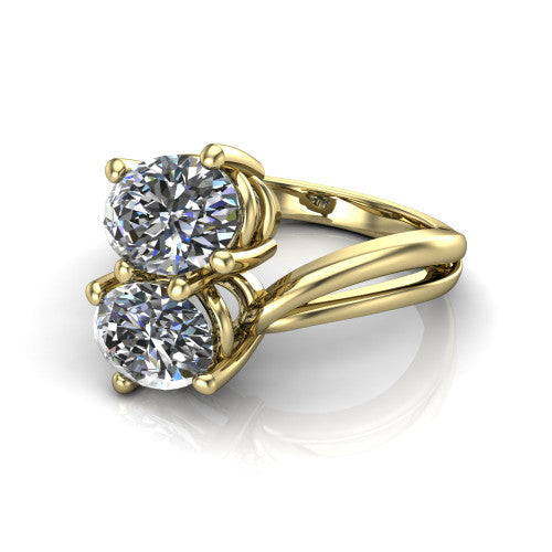 Lexi oval three stone engagement ring in 18K Yellow Gold, three-quarter perspective showing two brilliant oval diamonds set diagonally on a bypass split shank with plain bands