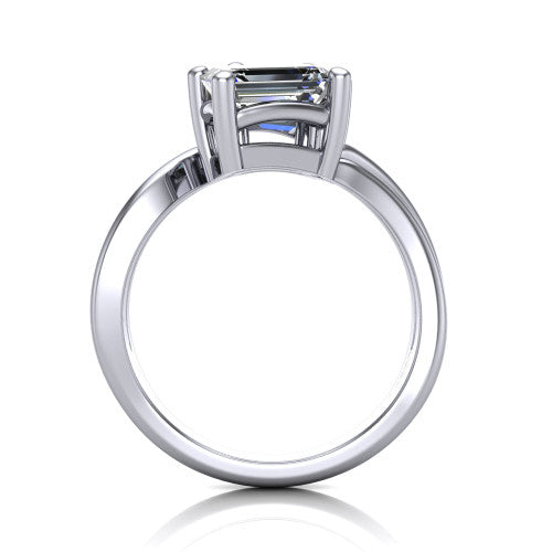 Lexi emerald three stone engagement ring in 18K White Gold, through-finger front profile showing the two-stone head and bypass split shank arms