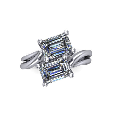 Lexi emerald three stone engagement ring in 18K White Gold, top-down view showing two step-cut emerald diamonds set diagonally in a toi et moi bypass arrangement
