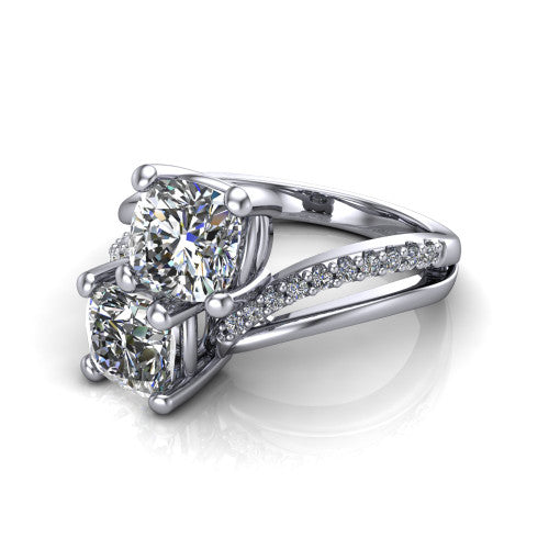 Julieta cushion three stone engagement ring in 18K White Gold, three-quarter perspective showing two brilliant cushion-cut diamonds set diagonally on a bypass split shank with pave diamonds
