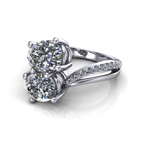Julieta oval three stone engagement ring in 14K White Gold, three-quarter perspective showing two brilliant oval diamonds set diagonally on a bypass split shank with pave diamonds