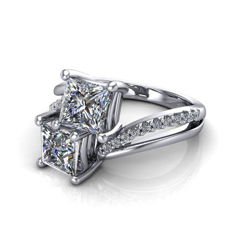 Julieta princess three stone engagement ring in 14K White Gold, three-quarter perspective showing two brilliant princess-cut diamonds set diagonally on a bypass split shank with pave diamonds
