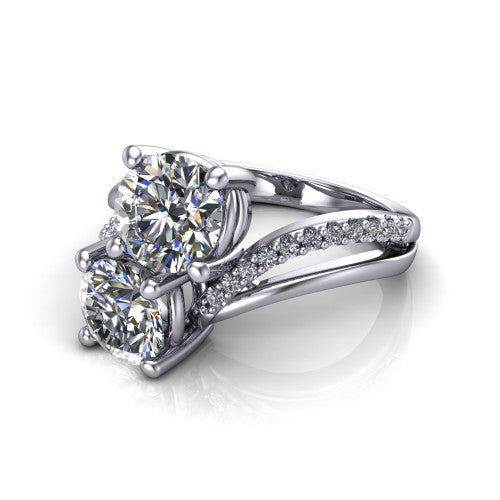 Julieta round three stone engagement ring in 14K White Gold, three-quarter perspective showing two brilliant round diamonds set diagonally on a bypass split shank with pave diamonds