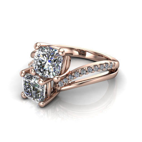 Julieta cushion three stone engagement ring in 14K Rose Gold, three-quarter perspective showing two brilliant cushion-cut diamonds set diagonally on a bypass split shank with pave diamonds