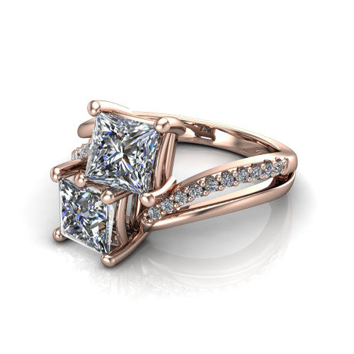 Julieta princess three stone engagement ring in 18K Rose Gold, three-quarter perspective showing two brilliant princess-cut diamonds set diagonally on a bypass split shank with pave diamonds