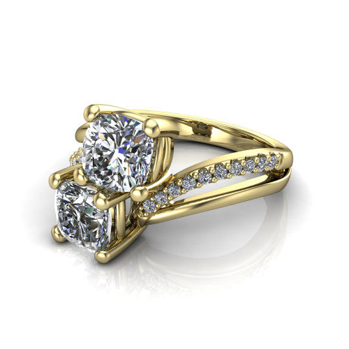 Julieta cushion three stone engagement ring in 14K Yellow Gold, three-quarter perspective showing two brilliant cushion-cut diamonds set diagonally on a bypass split shank with pave diamonds