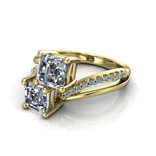 Julieta square emerald three stone engagement ring in 14K Yellow Gold, three-quarter perspective showing two step-cut square emerald diamonds set diagonally on a bypass split shank with pave diamonds