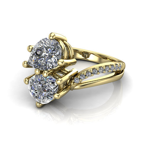 Julieta pear three stone engagement ring in 18K Yellow Gold, three-quarter perspective showing two brilliant pear-cut diamonds set diagonally on a bypass split shank with pave diamonds