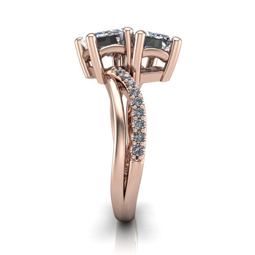 Julieta emerald three stone engagement ring in 14K Rose Gold, side profile showing the bypass split shank arms with pave diamonds running along both bands