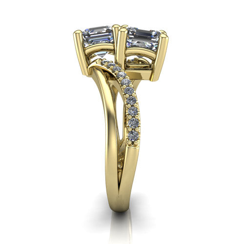 Julieta square emerald three stone engagement ring in 18K Yellow Gold, side profile showing the bypass split shank arms with pave diamonds running along both bands