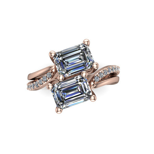 Julieta emerald three stone engagement ring in 14K Rose Gold, top-down view showing two step-cut emerald diamonds set diagonally in a toi et moi bypass arrangement